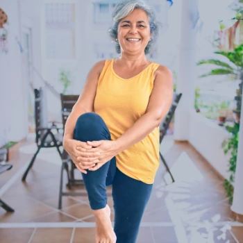 Senior woman stretching on lanai